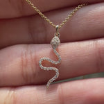 Dainty diamond snake pendant yellow gold video