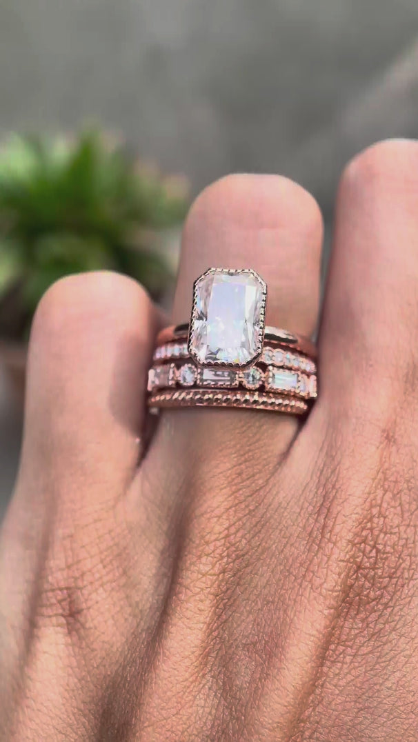 Trio rose gold wedding bands showcasing twisted, pave, and baguette details
