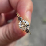 OEC round moissanite ring with black side stones video