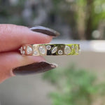 Rotating video showing full eternity mix-shape cluster wedding band details.