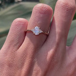 Oval lab diamond three stone ring on hand lifestyle video