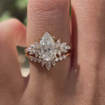 Close rotating view of pear moissanite ring with curved stacking band