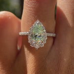 Light green pear moissanite halo engagement ring on fingure video
