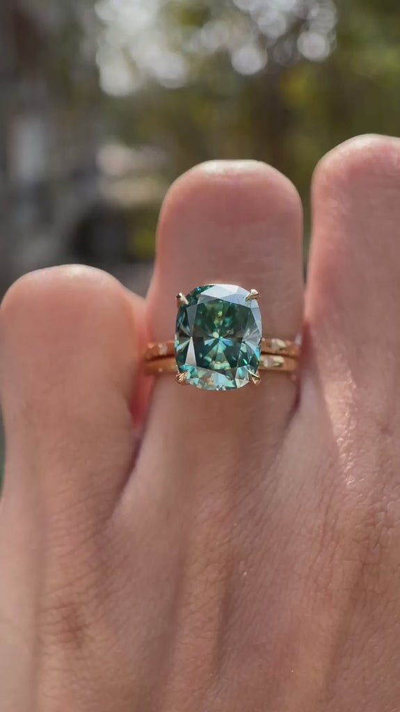 Blue green moissanite starburst engagement ring set with matching celestial band