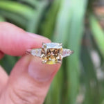 Rotating view of champagne cushion ring with baguette side stones set