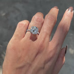 10k white gold engagement ring with large 4.7 CT round moissanite, cathedral setting, pave split shank