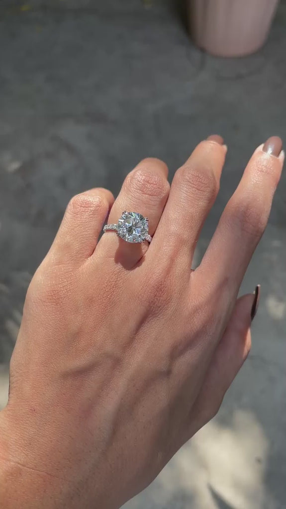10k white gold engagement ring with large 4.7 CT round moissanite, cathedral setting, pave split shank