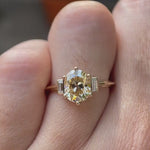 Video showcasing Champagne three-stone ring with baguette accents.