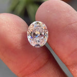 Oval crushed ice cut moissanite sparkling under natural light showing brilliance and clarity