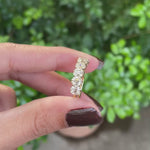 Elegant seven stone cushion moissanite wedding band in yellow gold, old mine cut, half eternity design