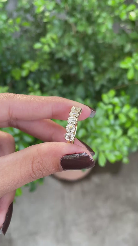 Elegant seven stone cushion moissanite wedding band in yellow gold, old mine cut, half eternity design