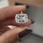 Close rotating view of elongated cushion solitaire ring with hidden halo.