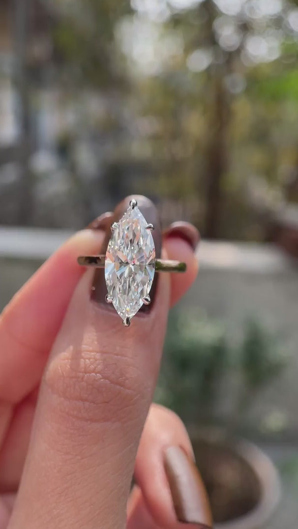 18K white and rose gold marquise solitaire ring on hand video