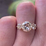 Champagne moissanite three stone engagement ring sparkle and hand view