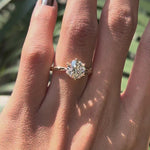 Rotating view round lab diamond twisted solitaire ring in yellow gold.