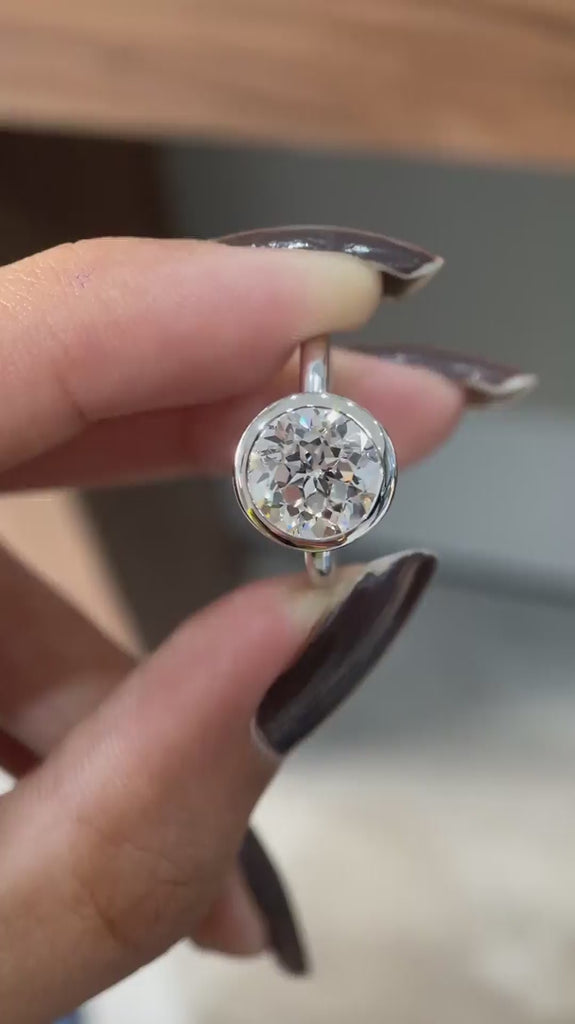 Floating bezel round star cut lab grown diamond ring rotating video