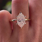 Video showing marquise moissanite solitaire ring sparkle in yellow gold.