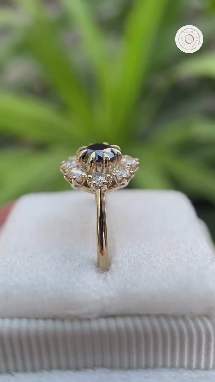Rotating views of black moissanite halo cluster ring