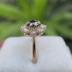 Rotating views of black moissanite halo cluster ring