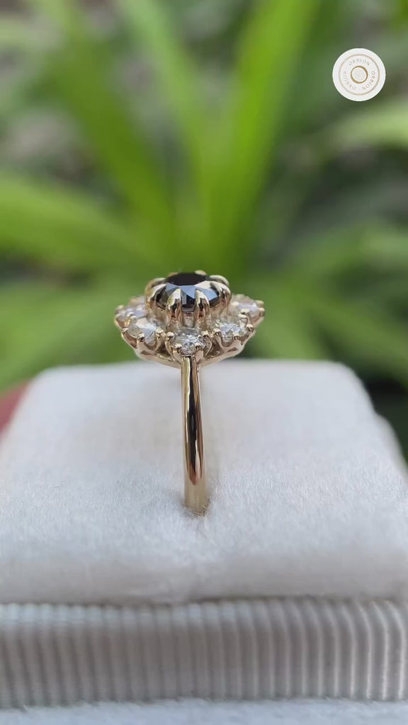 Rotating views of black moissanite halo cluster ring