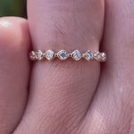 Close-up rotating view of bubble Wedding Band in Yellow Gold