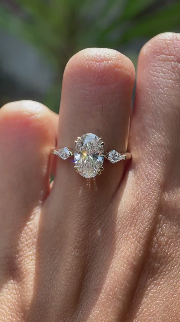 360 video of oval lab diamond trilogy ring in yellow gold