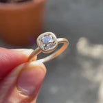 Video showing the Cushion Cut Old Mine Dark Champagne Moissanite Solitaire Bezel Set Engagement Ring