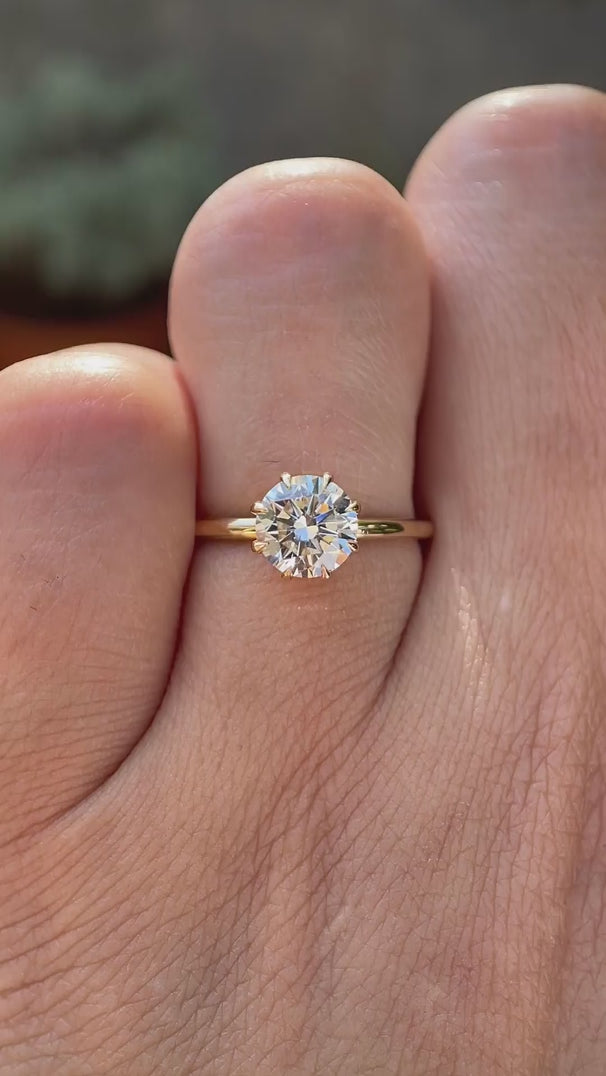 Round brilliant 1 CT lab grown diamond solitaire ring in 14K yellow gold rotating view