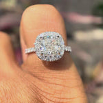 Cushion cut lab grown diamond cluster halo engagement ring in 18K white gold shown from multiple angles, highlighting pavé band and elevated halo setting.