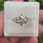 Rotating view of OEC Moissanite cluster engagement ring in yellow gold.