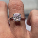 Video of Asscher cut Moissanite solitaire ring rotating in 14K white gold, showcasing its beauty and clarity.