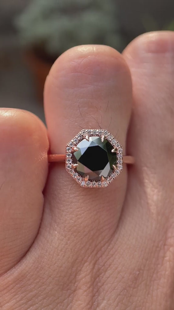 Video showing the 10K rose gold octagon black moissanite engagement ring with a halo of brilliant-cut moissanite stones.