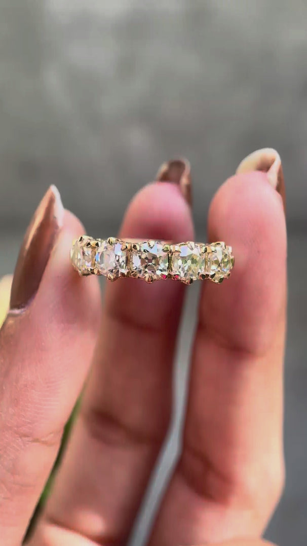 360 degree video of vintage five stone moissanite wedding band in solid gold