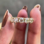 360 degree video of vintage five stone moissanite wedding band in solid gold
