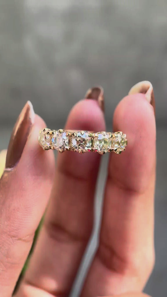 360 degree video of vintage five stone moissanite wedding band in solid gold