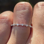 Minimalist white gold moissanite bubble band, dainty sparkle ring worn