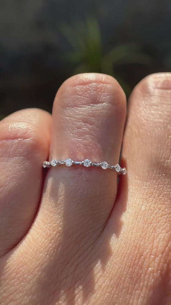 Minimalist white gold moissanite bubble band, dainty sparkle ring worn