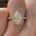 Pear cut lab grown diamond halo engagement ring shown in rotating video