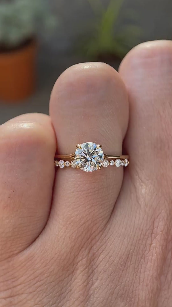 Round cut lab grown diamond engagement ring with diamond accented band in 14K yellow gold rotating view
