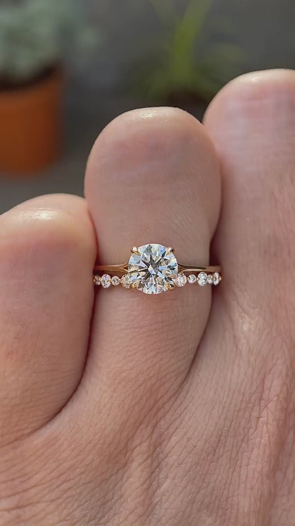 Round cut lab grown diamond engagement ring with diamond accented band in 14K yellow gold rotating view