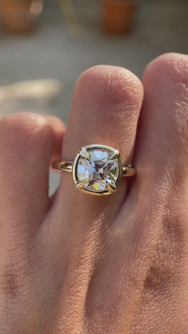 Vintage style bezel set cushion moissanite ring on hand video