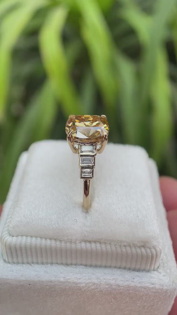 Elongated cushion old mine cut dark champagne moissanite ring with baguette side stones shown from multiple angles