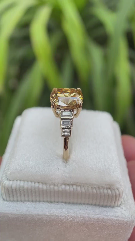 Elongated cushion old mine cut dark champagne moissanite ring with baguette side stones shown from multiple angles