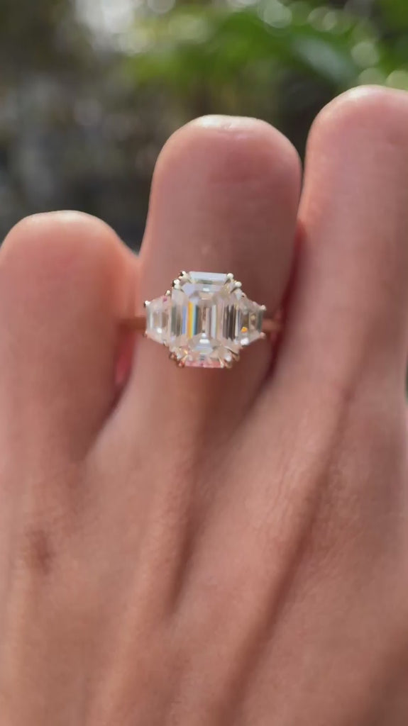 Emerald lab diamond ring with trapezoid side stones front view video