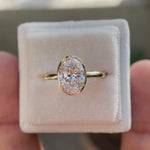 oval moissanite solitaire ring with smooth gold bezel video