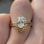 Oval lab grown diamond cluster engagement ring set in 14K yellow gold shown from multiple angles