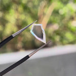 Shield portrait cut moissanite gemstone showcasing clean transparency and geometric silhouette