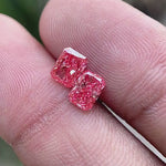 Rotating view of 1.6 TCW vivid pink radiant diamond pair