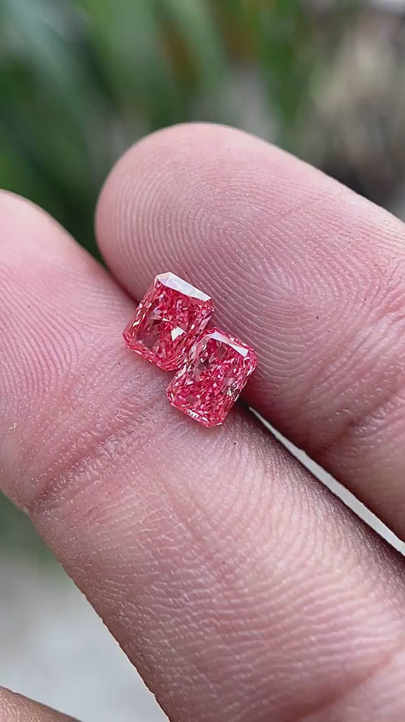 Rotating view of 1.6 TCW vivid pink radiant diamond pair