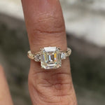 Video showing the three-stone Moissanite engagement ring from all angles in 10K yellow gold.